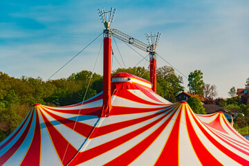 Spring landscape with a red and white circus tent on a sunny day at Postmuenster, Rottal Inn, Bavaria, Germany