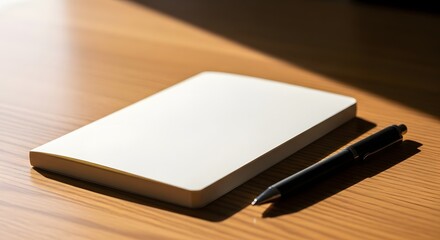 Blank notebook with pen on wooden desk for writing ideas planning journaling and creative inspiration