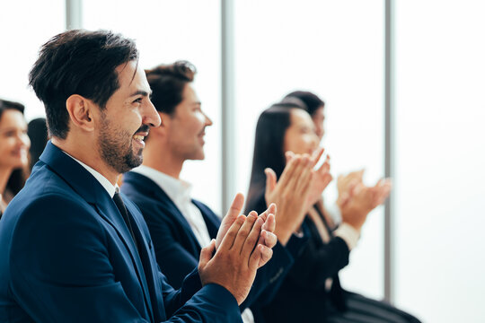 audience clapping hands : group of diverse audience people company employees clapping hands for success in meeting conference room