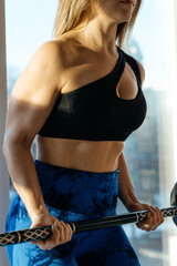 sport woman does exercises at the gym 