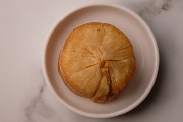 fried cassava on a white ceramic plate. Cassava is a staple food and one of the sources of...
