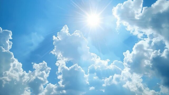 A radiant sun shining in a clear, bright sky filled with fluffy clouds