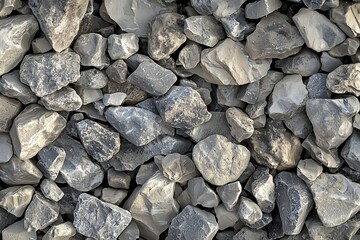 Highly realistic close-up of mixed crushed stone gravel with uneven edges, dust accumulation between rock pieces and rough surface shadows&mdash;ideal for construction, landscape or rugged background use