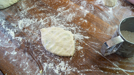 The process of making pies on a wooden table