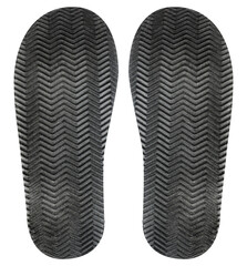 Isolated photo of black rubber patterned shoe protector on white background.