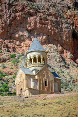 Church and beautiful natural landscape. Monastery in nature. Armenian Apostolic Church Noravank. Beautiful architecture of the church. Monastery against the backdrop of rocky mountains. Christianity i