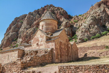 Church and beautiful natural landscape. Monastery in nature. Armenian Apostolic Church Noravank. Beautiful architecture of the church. Monastery against the backdrop of rocky mountains. Christianity i