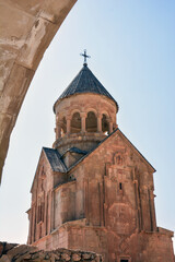 Church and beautiful natural landscape. Monastery in nature. Armenian Apostolic Church Noravank. Beautiful architecture of the church. Monastery against the backdrop of rocky mountains. Christianity i