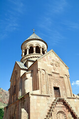 Church and beautiful natural landscape. Monastery in nature. Armenian Apostolic Church Noravank. Beautiful architecture of the church. Monastery against the backdrop of rocky mountains. Christianity i