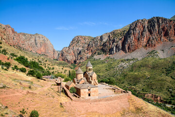 Church and beautiful natural landscape. Monastery in nature. Armenian Apostolic Church Noravank. Beautiful architecture of the church. Monastery against the backdrop of rocky mountains. Christianity i