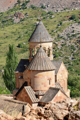 Church and beautiful natural landscape. Monastery in nature. Armenian Apostolic Church Noravank. Beautiful architecture of the church. Monastery against the backdrop of rocky mountains. Christianity i