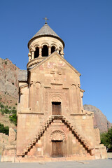 Church and beautiful natural landscape. Monastery in nature. Armenian Apostolic Church Noravank. Beautiful architecture of the church. Monastery against the backdrop of rocky mountains. Christianity i