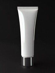 A sleek, white, glossy cosmetic tube with a metallic cap stands upright against a black background, featuring a minimalist design with no visible branding or text.