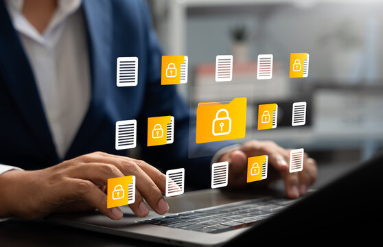 Businessman using laptop to access secure digital folder and document, Cybersecurity, Data privacy, Protected information. Concept of safe file management, encryption,modern digital security systems