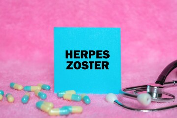 Herpes Zoster writing concept on sticky note isolated on pink background. stethoscope as decoration.