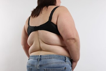 Overweight woman on white background, closeup view
