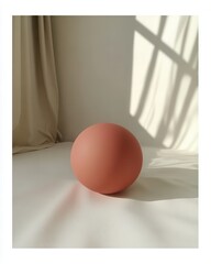 A minimalist scene featuring a soft pink sphere on a light surface with gentle shadows