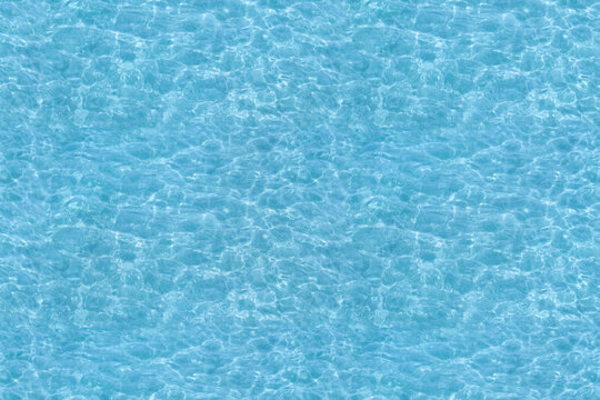 Water ripple seamless background texture - top view of clean, clear, blue water ripples. Image can be tiled to create a larger image or higher resolution background. Water has the chemical formula H2O