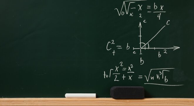 Mathematical equations on chalkboard in classroom setting  