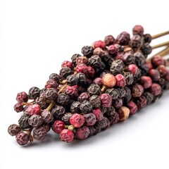 Close up of Fresh Red and Black Peppercorns on White Background A Detailed View of Spicy Pepper...