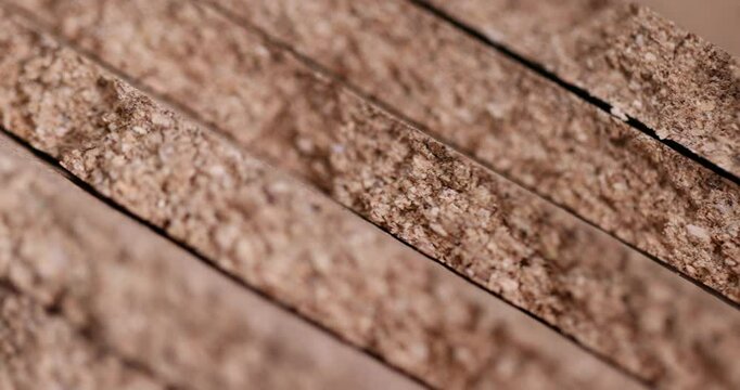 cork wood, which is used in industry and household needs, is a natural soft and durable material that is obtained from the bark of a cork tree closeup, broken cork wood panel