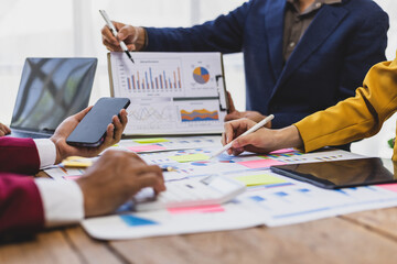 Businessman analyzing marketing and financial chart on desk. Businessman meeting with financial...