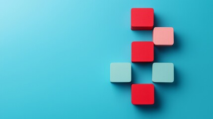 Colorful geometric blocks on a blue background creating a unique arrangement.