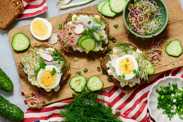 Danish Open-Faced Sandwich with herring on slices of rye bread.top veiw