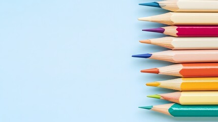 Fototapeta premium Colorful Pencils on Blue Background Art Supplies