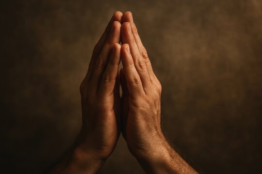 Hands in prayer gesture.