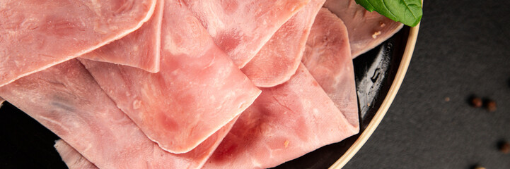 Ham slices meat spam pork fresh delicious gourmet food background on the table rustic food top view...
