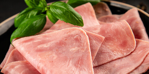 Ham slices meat spam pork fresh delicious gourmet food background on the table rustic food top view...