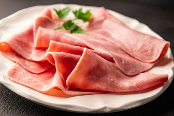 Ham slices meat spam pork fresh delicious gourmet food background on the table rustic food top view...