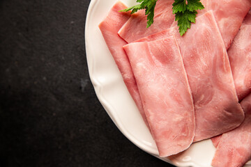 Ham slices meat spam pork fresh delicious gourmet food background on the table rustic food top view copy space