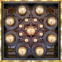Circular chandelier with lit candles from below