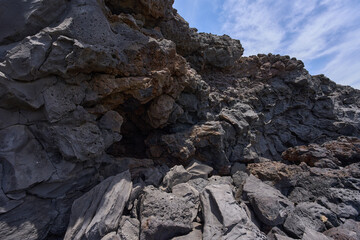 Textured volcanic rock by the sea