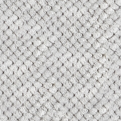 Seamless 4k photo texture of light gray colored synthetic fur knitted sweater material.