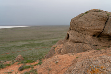 Fancy stones on the slopes of Bolshoe Bogdo Mountain and the salt lake Baskunchak in the distance...