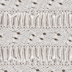 Seamless 4k photo texture of ivory colored woven ornate wool cloth material.