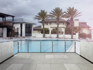 View from the balcony to the pool and appartaments.Landscape. Sunny Day. Terrace with a beautiful view. Background with beautiful landscape. Appartament for vacation.