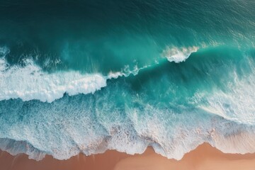 Fototapeta premium Aerial View of Turquoise Ocean Waves Crashing on Sandy Beach Shoreline