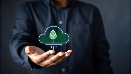 A person holds a digital cloud icon with a green leaf, symbolizing eco-friendly technology and sustainability.