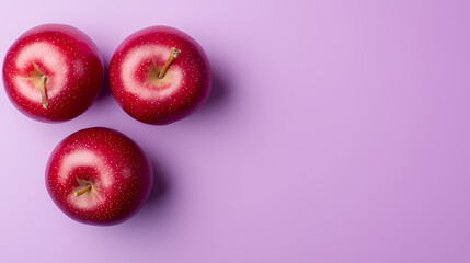 red apples on purple background
