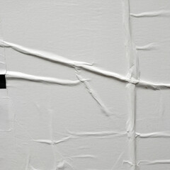 white crumpled and creased glued wrinkled paper poster texture background,papers printed in offset...