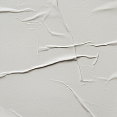 Obraz premium white crumpled and creased glued wrinkled paper poster texture background,papers printed in offset (dots) and glued to a wall with folds. Paris, France.