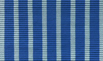 blue and cyan striped carpet texture background in close up view, perfect for flooring, rugs, and interior design concepts. pop art pattern for interior design.