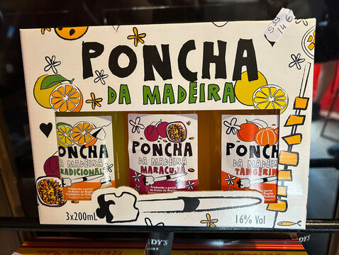 Bottles of poncha on a store shelf. Close-up. Funchal. Madeira. Portugal.