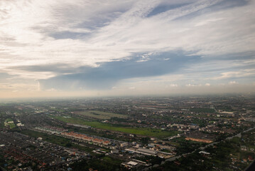Aerial view of urban landscape with clouds modern city daylight wide shot urban development