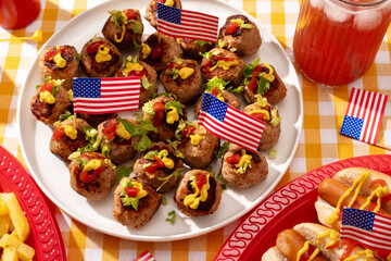 Closeup of meatballs decorated with USA flags and other patriotic dishes for 4th of July