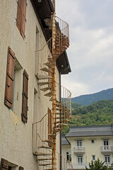 spiral fire escape stairs on a traditional house in rance